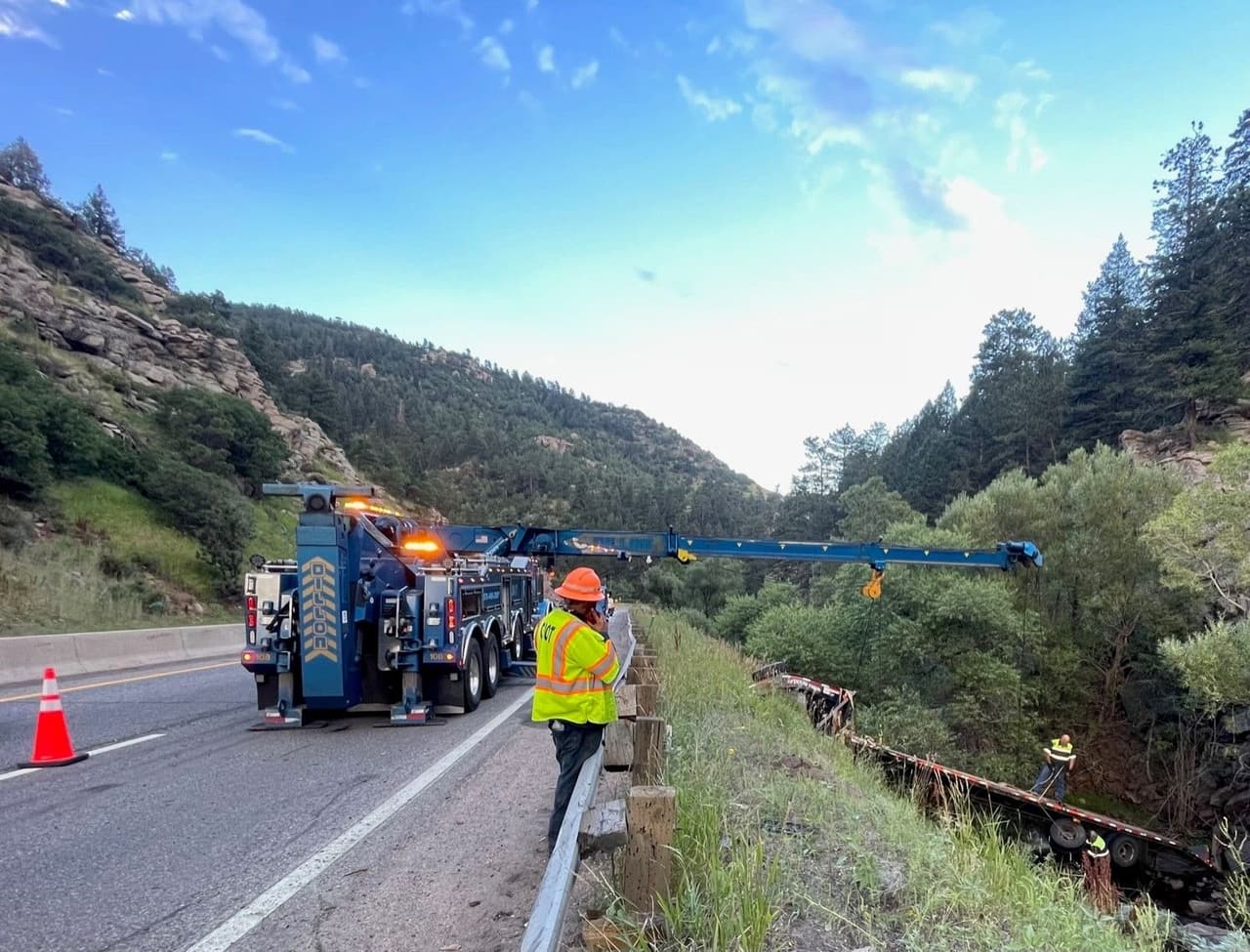 Western Towing rotator recovering a trailer from a mountain canyon