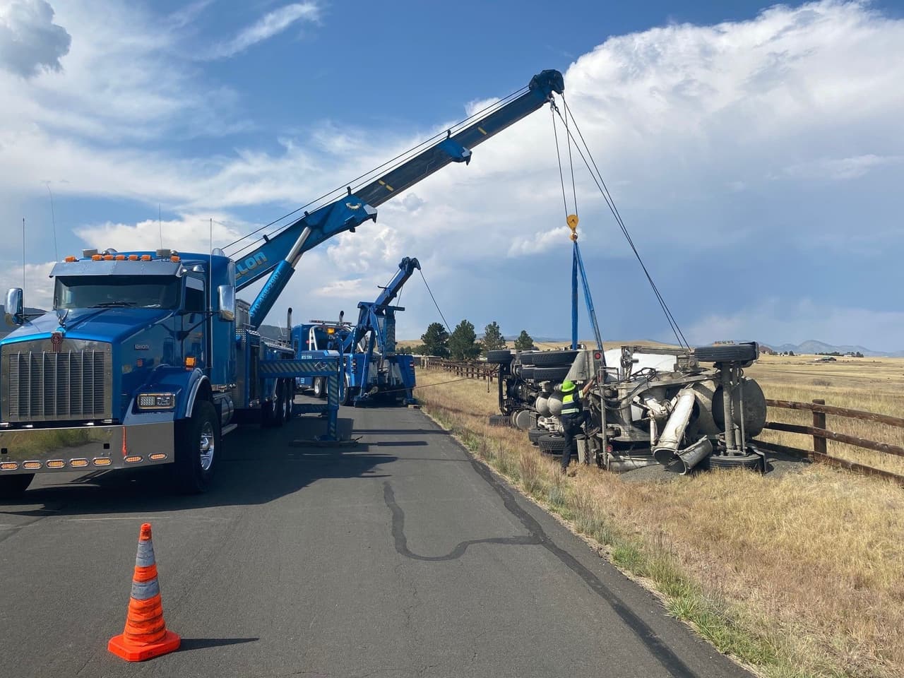 Western Towing rotator lifting a crashed car from a riverbank
