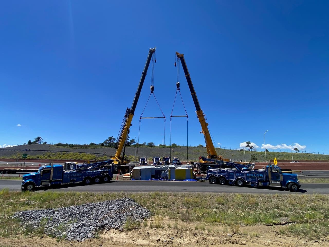 Two Western Towing rotators working a tandem lift with two cranes